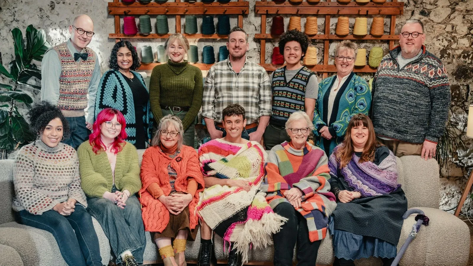 Cast of Game of Wool sat on a sofa