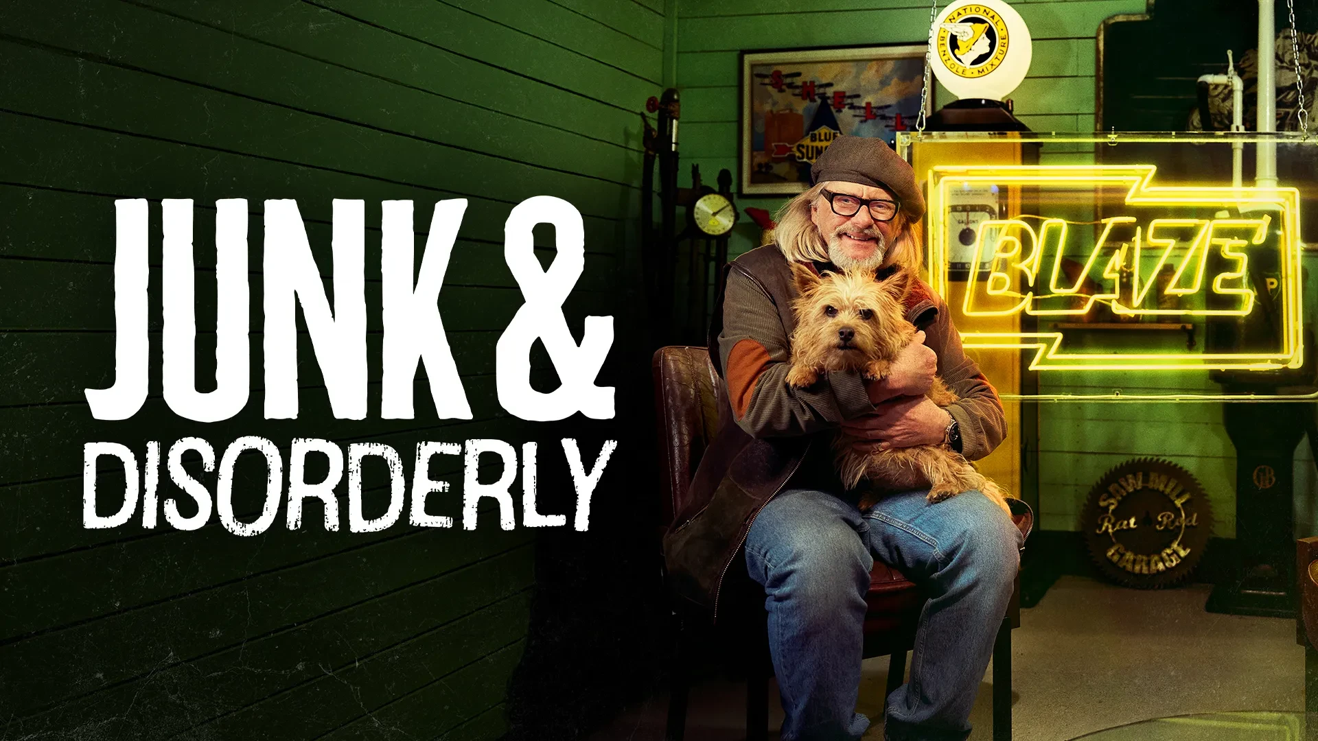 Key art for Junk & Disorderly shows host Henry Cole, holding a dog, sitting in a shed filled with junk. The words Junk & Disorderly and Blaze, its TV channel, are shown