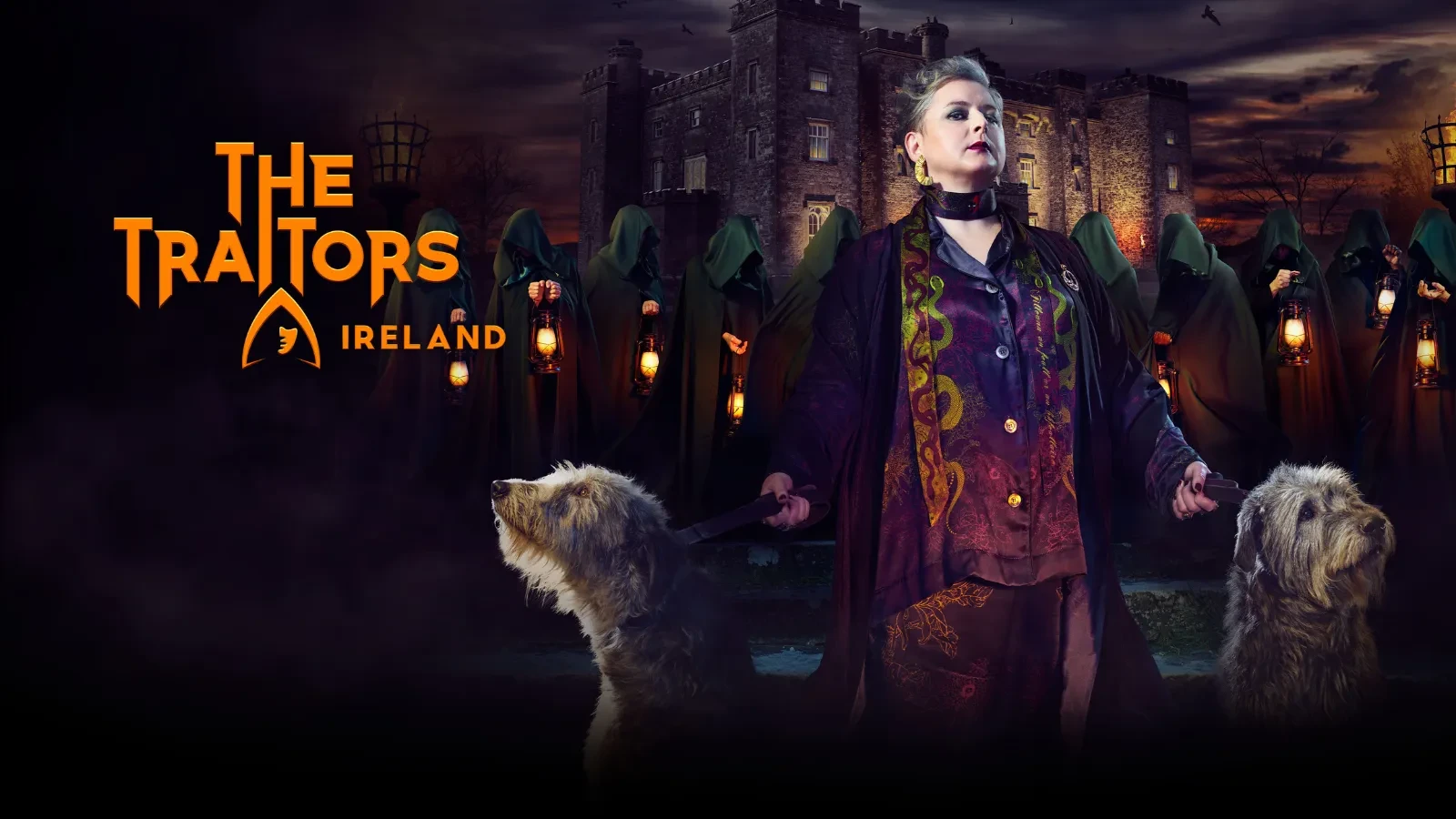 A women wearing a black robe and purple silk holding two dogs with people behind her wearing green cloaks and a castle in the background