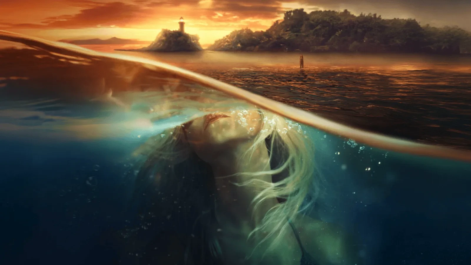 Split-view image showing a woman underwater with her head tilted back toward the surface, illuminated by soft light. Above the waterline, a calm sea reflects a dramatic sunset with an island and lighthouse in the distance. 