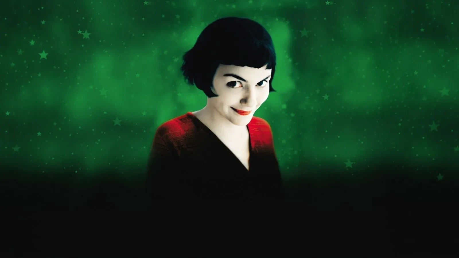 Promotional image for Amelie, pale woman with dark hair smiling at the camera against a dark green background