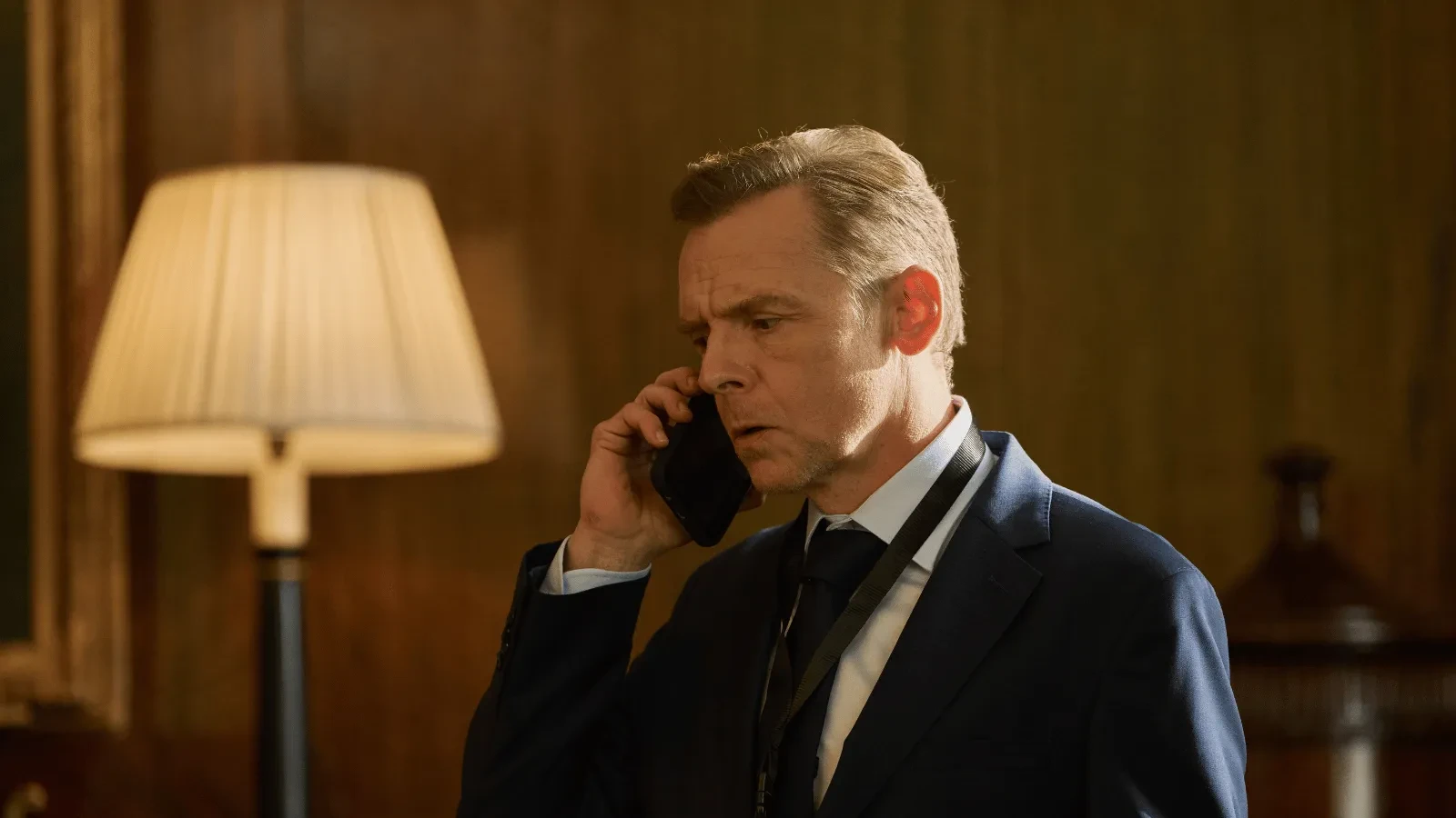 Government official takes an urgent phone call amid escalating cybersecurity and national security concerns in The Undeclared War.